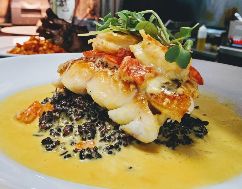 Pan Seared Local Grouper , Black Forbidden Rice, Saffron and Preserved Lemon Beurre Blanc, Local Butter Poached Shrimp, Micro Greens
